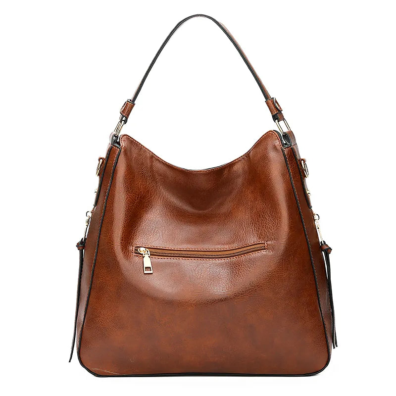 A stylish PU leather shoulder hobo bag with zipper closure and multiple interior pockets, perfect for versatile use by women.