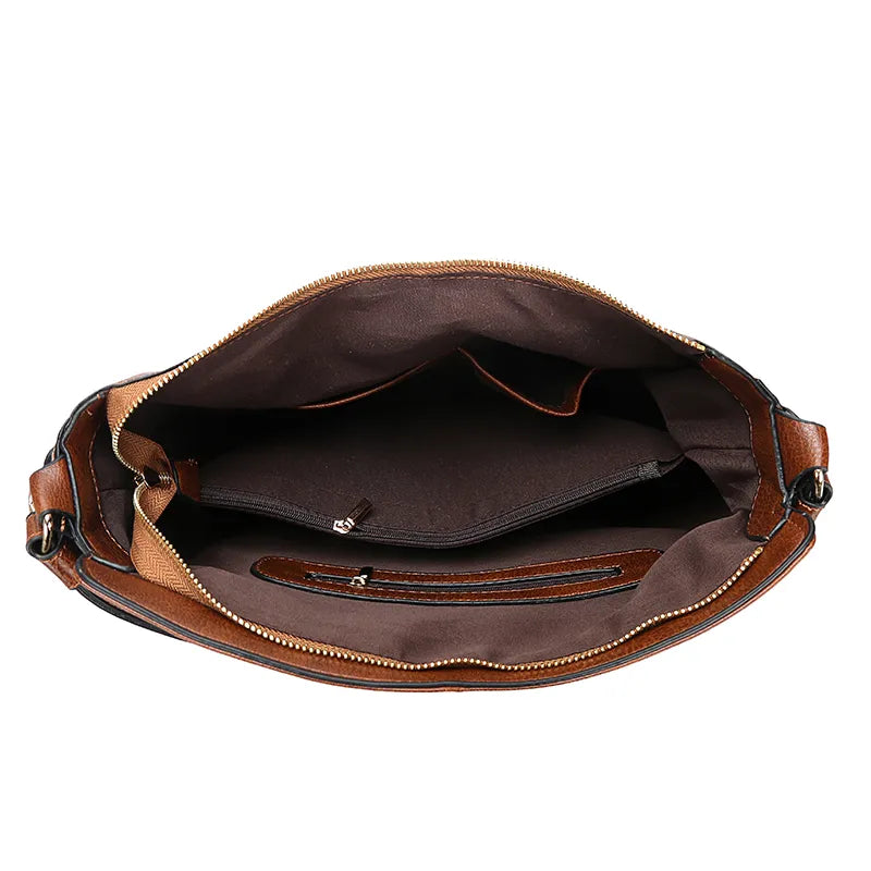 A stylish PU leather shoulder hobo bag with zipper closure and multiple interior pockets, perfect for versatile use by women.
