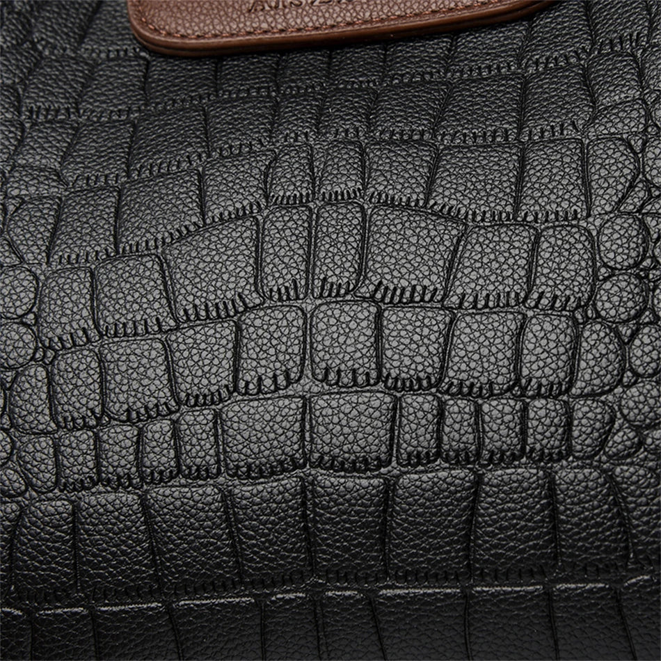 A stylish genuine leather alligator shoulder bag adorned with letter, sequined, kangaroo, and leaf ornament decorations, perfect for women on the go.