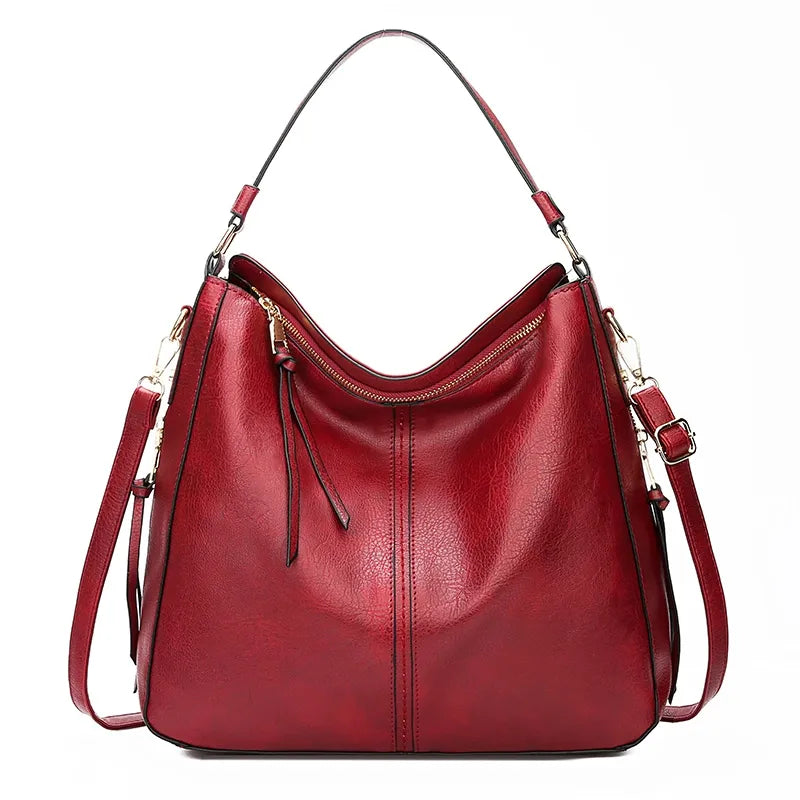 A stylish PU leather shoulder hobo bag with zipper closure and multiple interior pockets, perfect for versatile use by women.
