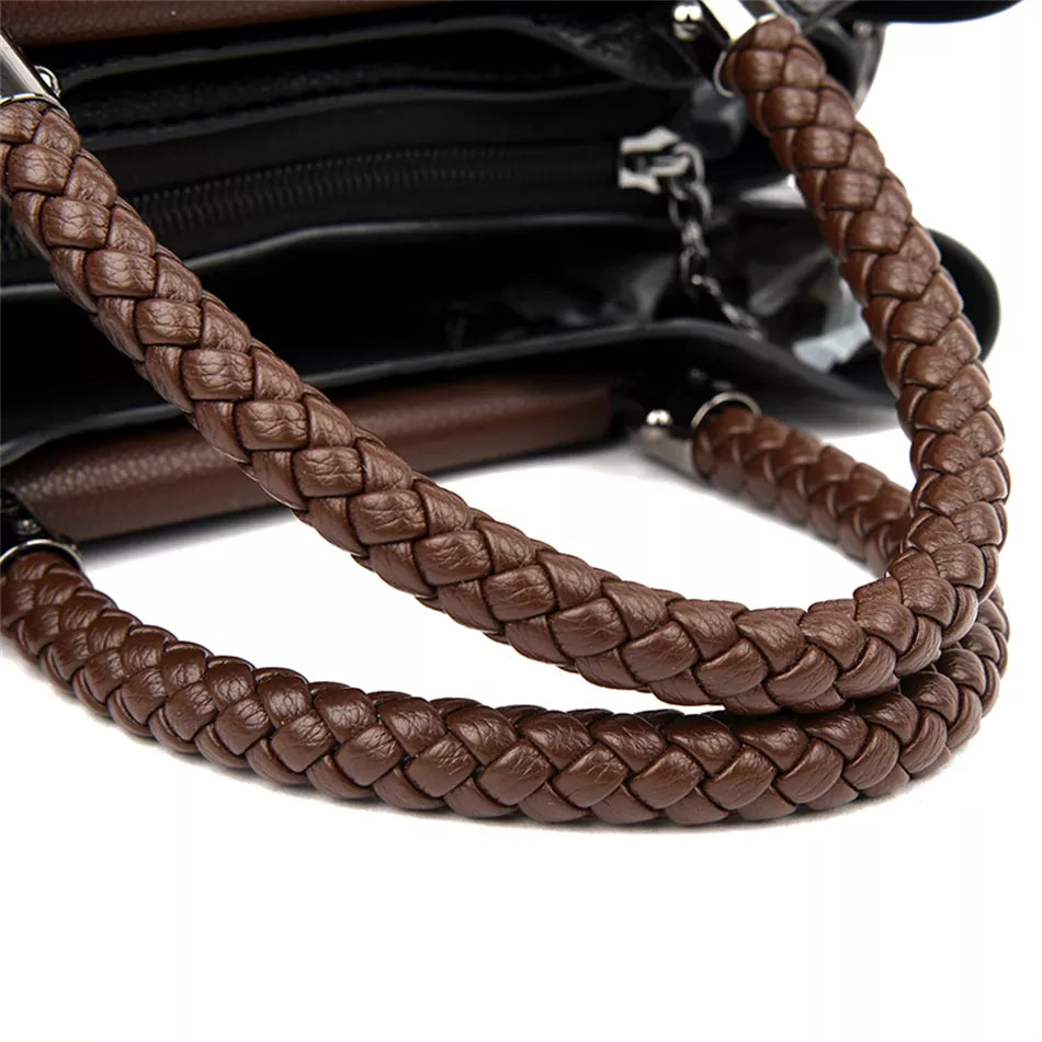 A stylish genuine leather alligator shoulder bag adorned with letter, sequined, kangaroo, and leaf ornament decorations, perfect for women on the go.