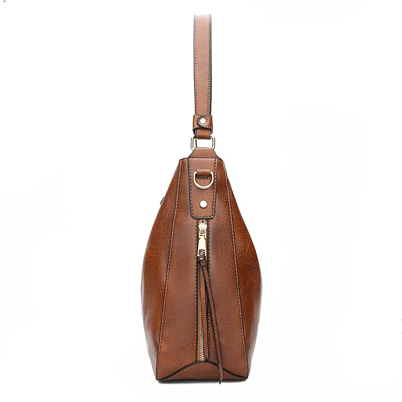 A stylish PU leather shoulder hobo bag with zipper closure and multiple interior pockets, perfect for versatile use by women.