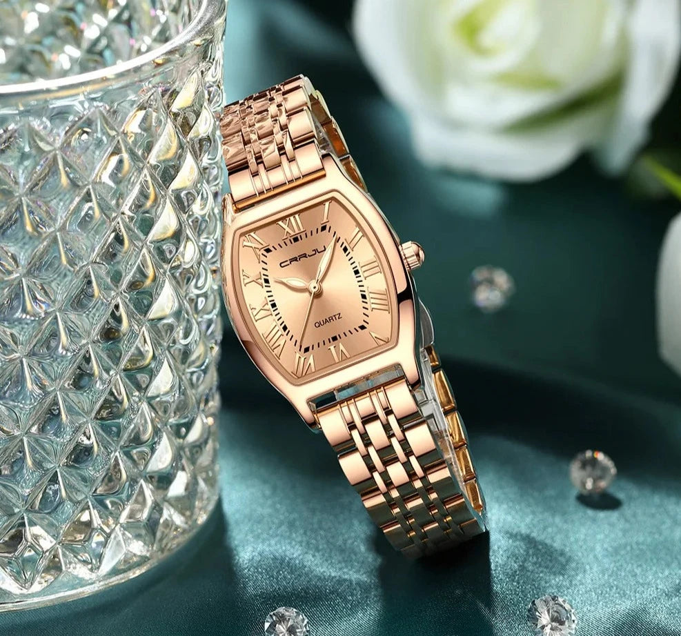 A close-up of a Steel Dress Bracelet Watch featuring a tonneau-shaped alloy case and stainless steel bracelet. The watch dial displays the time against a Hardlex window, with water resistance up to 3Bar.