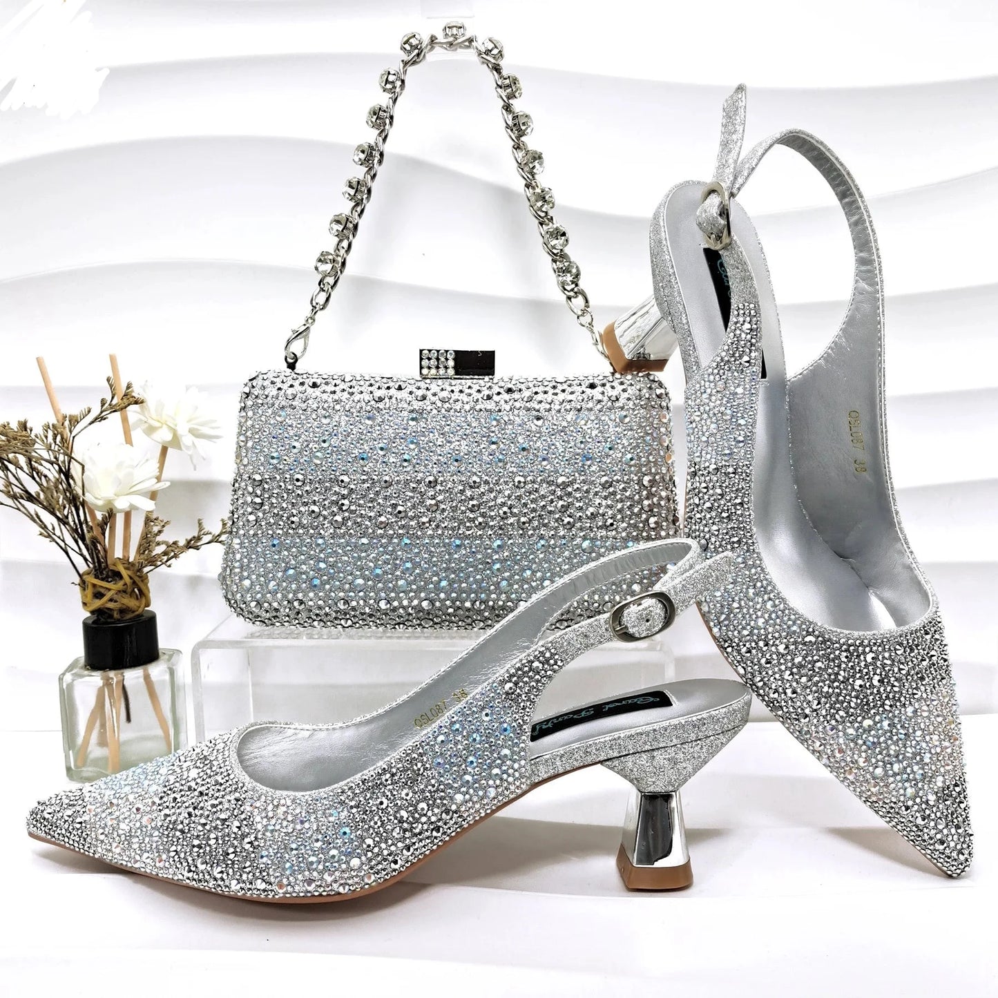 Image of Fashion Forward Strange Style Slingback Pumps in silver color, featuring a pointed toe, super high strange style heel, and crystal embellishments. Perfect for parties and special occasions.