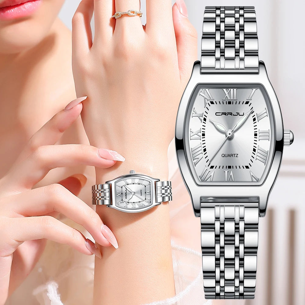 A close-up of a Steel Dress Bracelet Watch featuring a tonneau-shaped alloy case and stainless steel bracelet. The watch dial displays the time against a Hardlex window, with water resistance up to 3Bar.