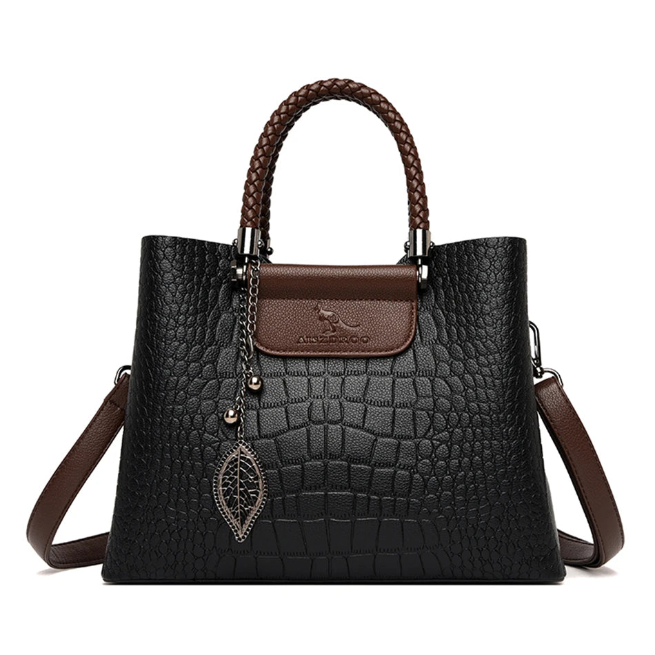 A stylish genuine leather alligator shoulder bag adorned with letter, sequined, kangaroo, and leaf ornament decorations, perfect for women on the go.