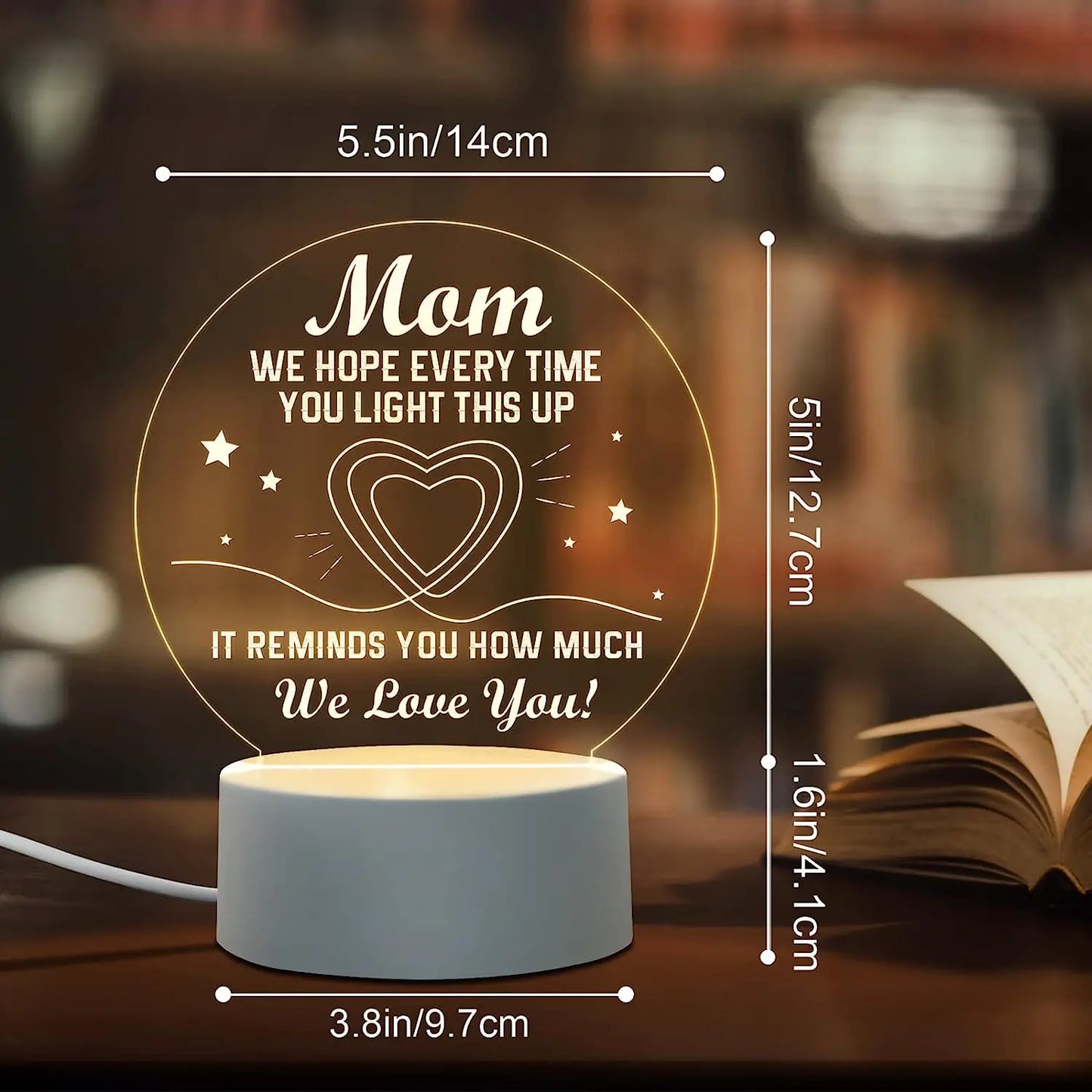 A close-up of an Engraved Acrylic Mom Night Light with LED bulbs, featuring a DIY shape and engraved with heartfelt sentiments. The night light is illuminated with a warm glow, perfect for bedroom decor.