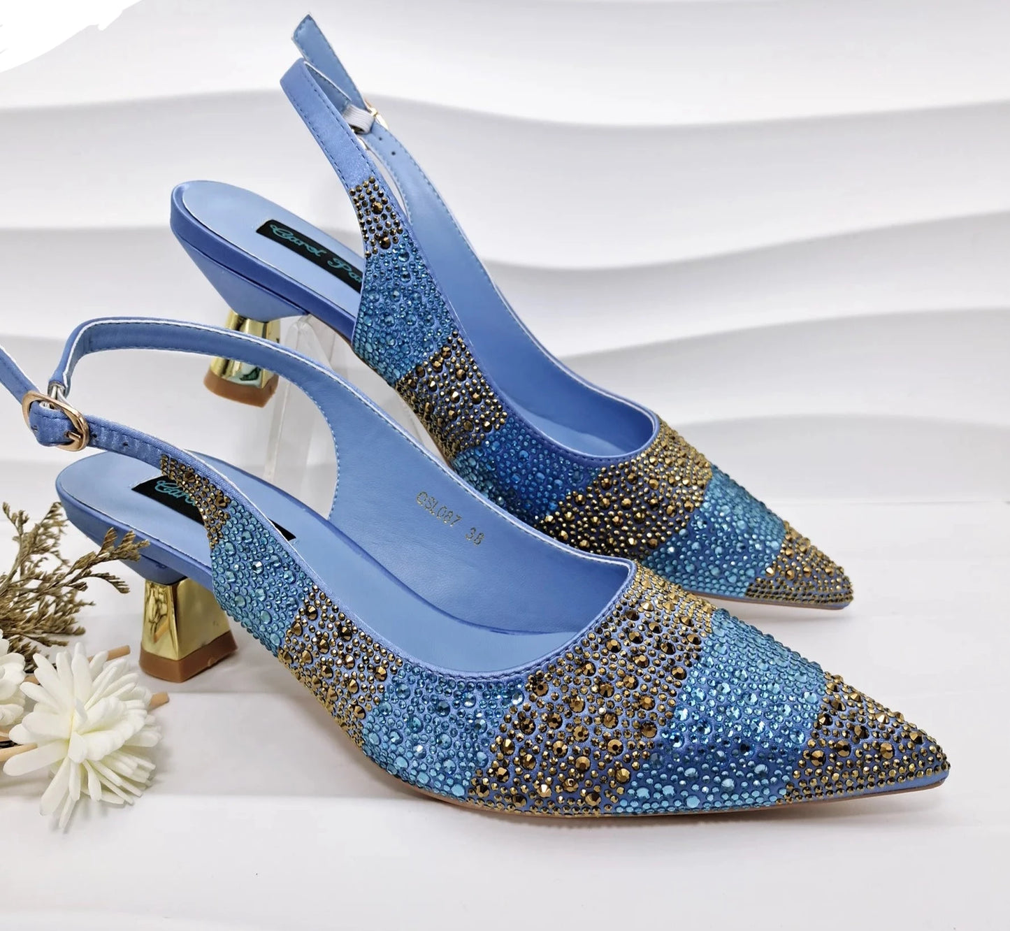 Image of Fashion Forward Strange Style Slingback Pumps in blue color, featuring a pointed toe, super high strange style heel, and crystal embellishments. Perfect for parties and special occasions.