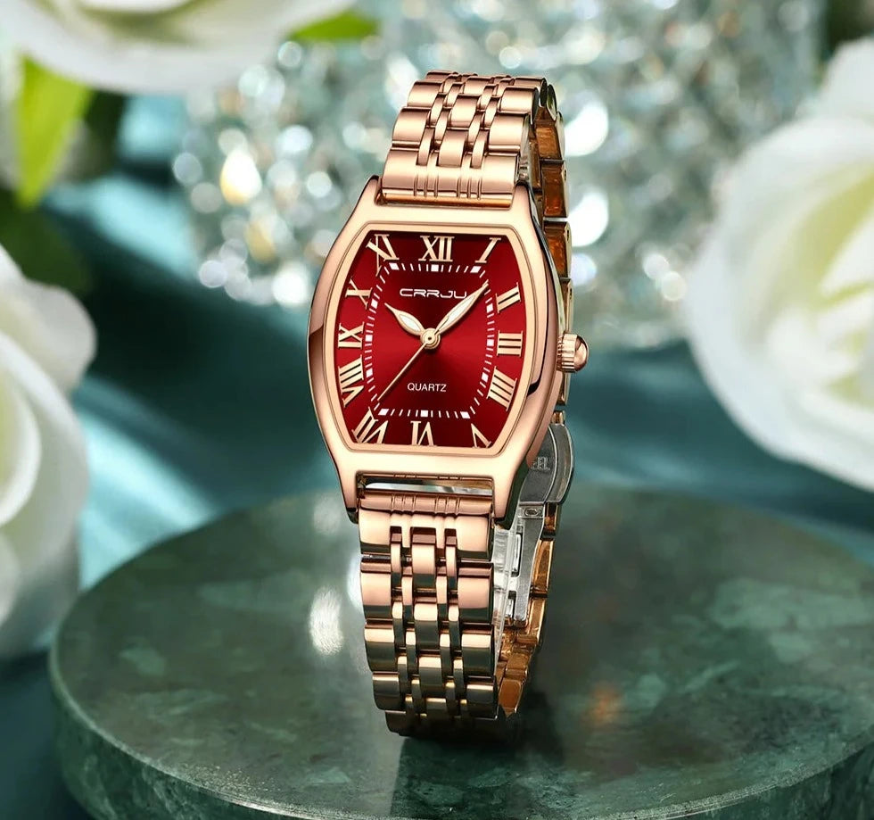 A close-up of a Steel Dress Bracelet Watch featuring a tonneau-shaped alloy case and stainless steel bracelet. The watch dial displays the time against a Hardlex window, with water resistance up to 3Bar.