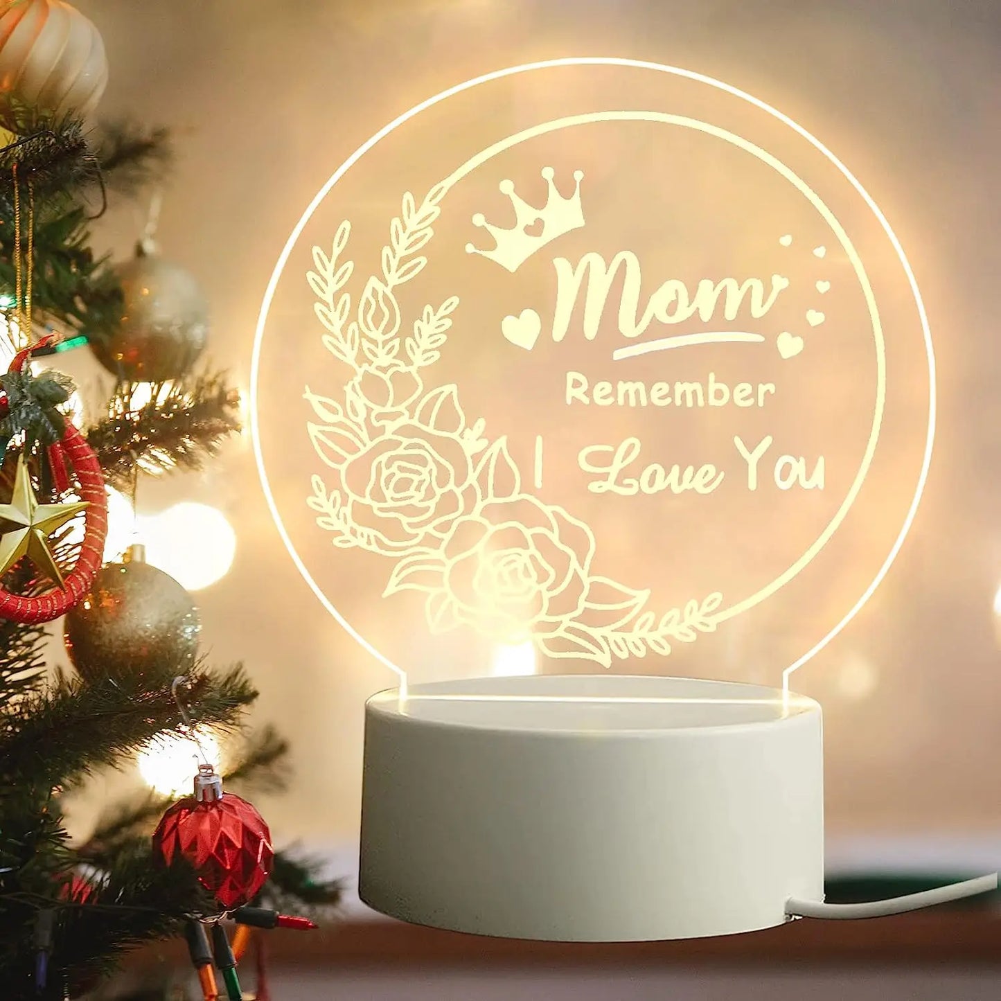 A close-up of an Engraved Acrylic Mom Night Light with LED bulbs, featuring a DIY shape and engraved with heartfelt sentiments. The night light is illuminated with a warm glow, perfect for bedroom decor.