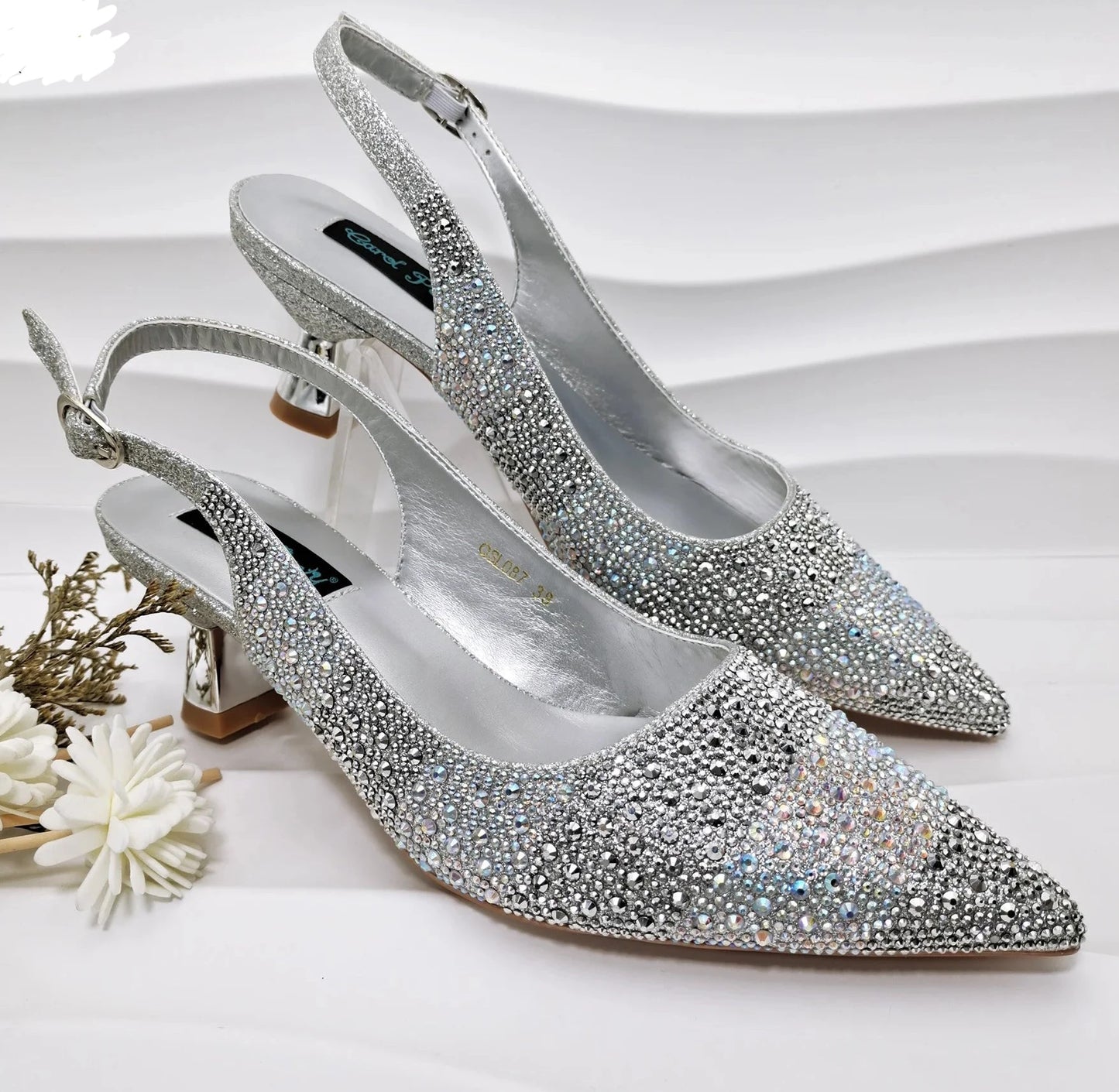 Image of Fashion Forward Strange Style Slingback Pumps in silver color, featuring a pointed toe, super high strange style heel, and crystal embellishments. Perfect for parties and special occasions.