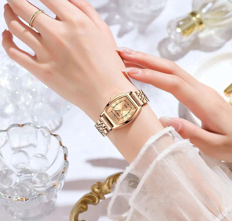 A close-up of a Steel Dress Bracelet Watch featuring a tonneau-shaped alloy case and stainless steel bracelet. The watch dial displays the time against a Hardlex window, with water resistance up to 3Bar.
