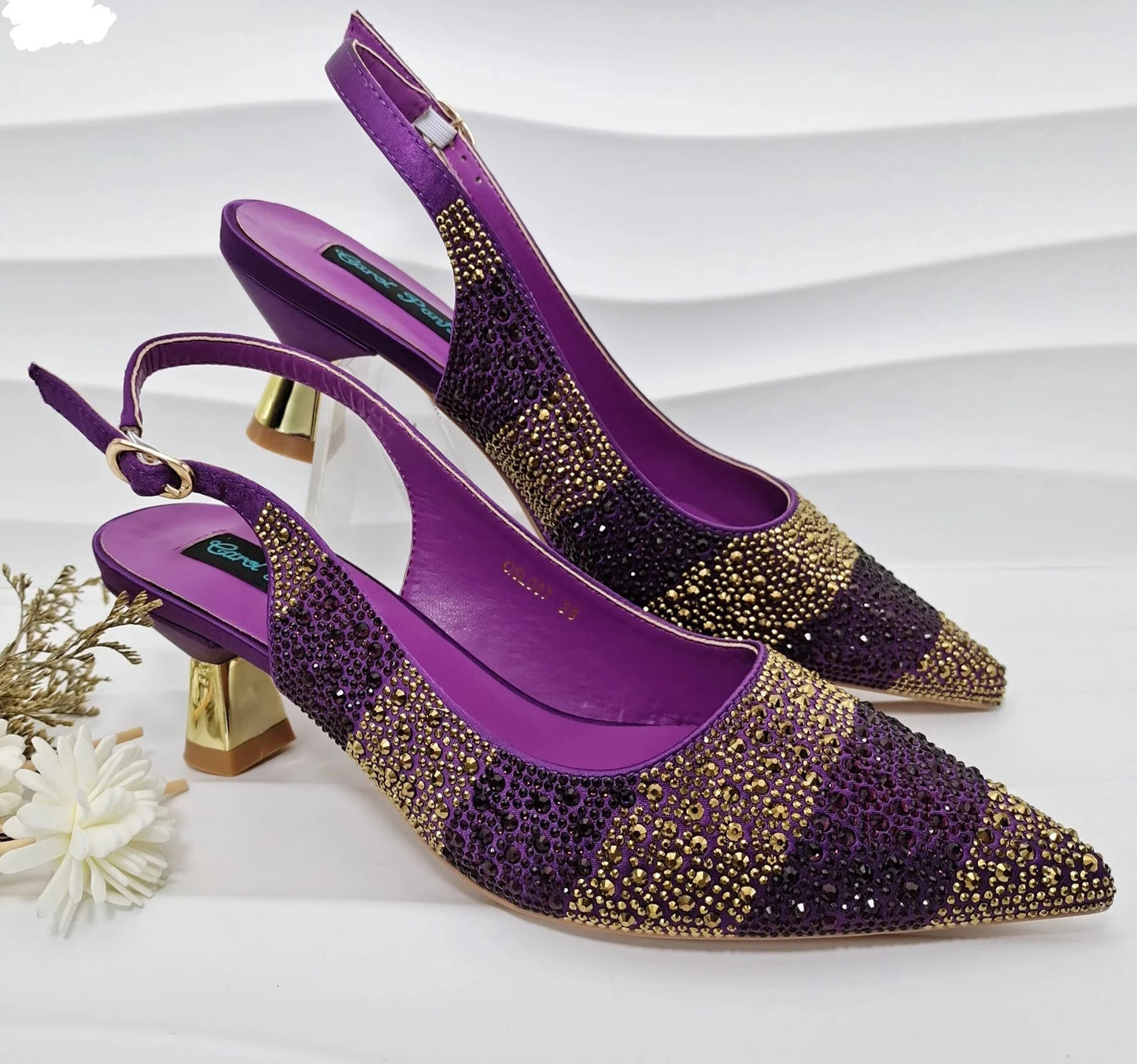 Image of Fashion Forward Strange Style Slingback Pumps in purple color, featuring a pointed toe, super high strange style heel, and crystal embellishments. Perfect for parties and special occasions.