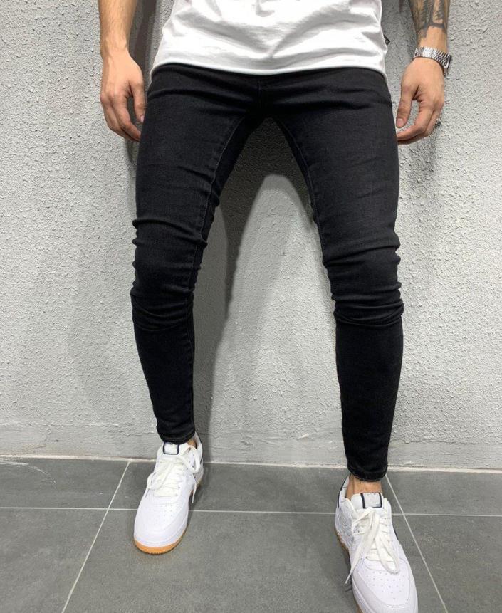 Men's Fashion Street Style Ripped Skinny Jeans with stonewashed and distressed details. Perfect for spring and autumn street style.