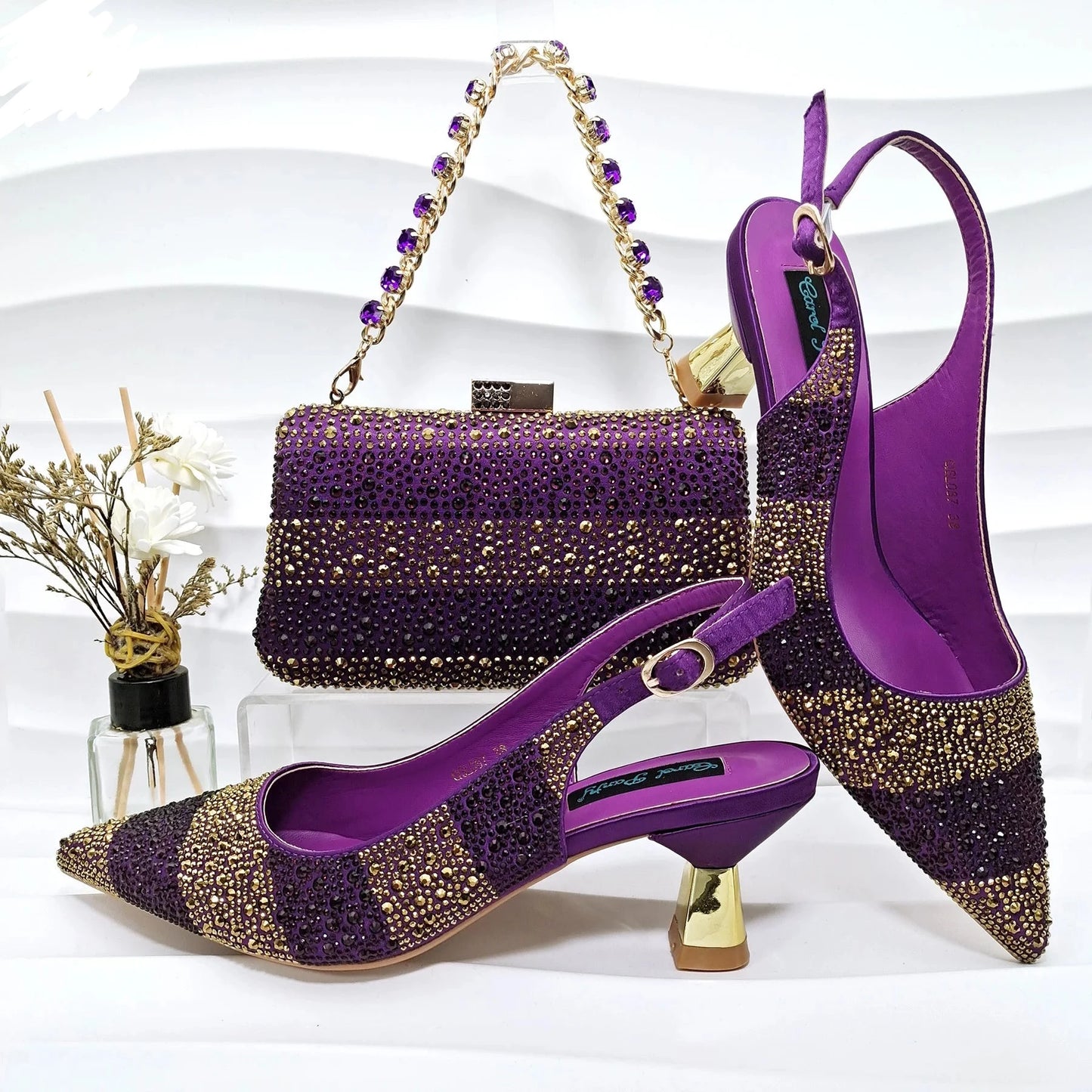 Image of Fashion Forward Strange Style Slingback Pumps in purple color, featuring a pointed toe, super high strange style heel, and crystal embellishments. Perfect for parties and special occasions.