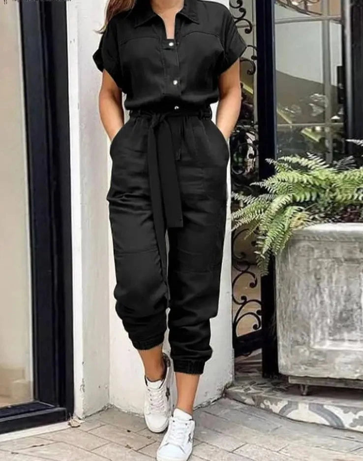 High Street Cargo Jumpsuit in POLYESTER broadcloth, featuring high waist and ankle-length cargo pants. Decorative pockets add flair. Lightweight and stylish summer fashion for women.