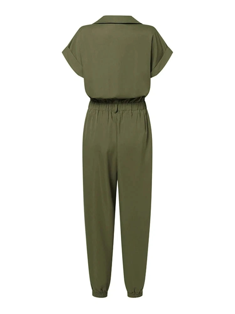 High Street Cargo Jumpsuit in POLYESTER broadcloth, featuring high waist and ankle-length cargo pants. Decorative pockets add flair. Lightweight and stylish summer fashion for women.