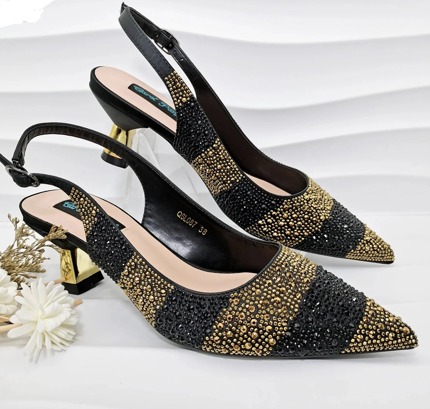 Image of Fashion Forward Strange Style Slingback Pumps in gold color, featuring a pointed toe, super high strange style heel, and crystal embellishments. Perfect for parties and special occasions.