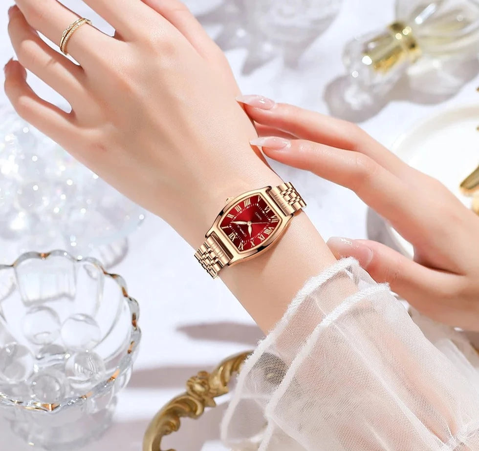 A close-up of a Steel Dress Bracelet Watch featuring a tonneau-shaped alloy case and stainless steel bracelet. The watch dial displays the time against a Hardlex window, with water resistance up to 3Bar.