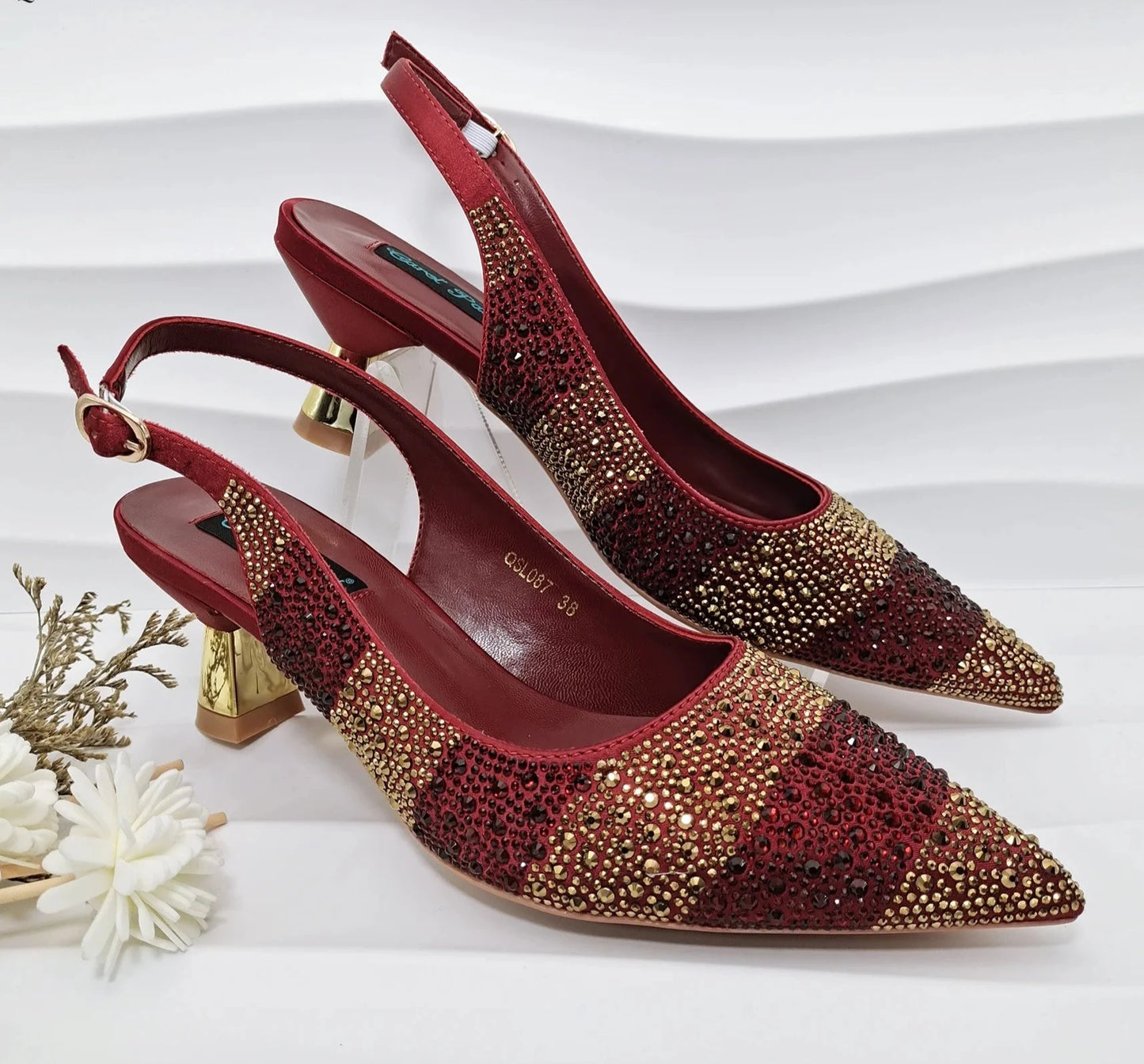 Image of Fashion Forward Strange Style Slingback Pumps in red color, featuring a pointed toe, super high strange style heel, and crystal embellishments. Perfect for parties and special occasions.