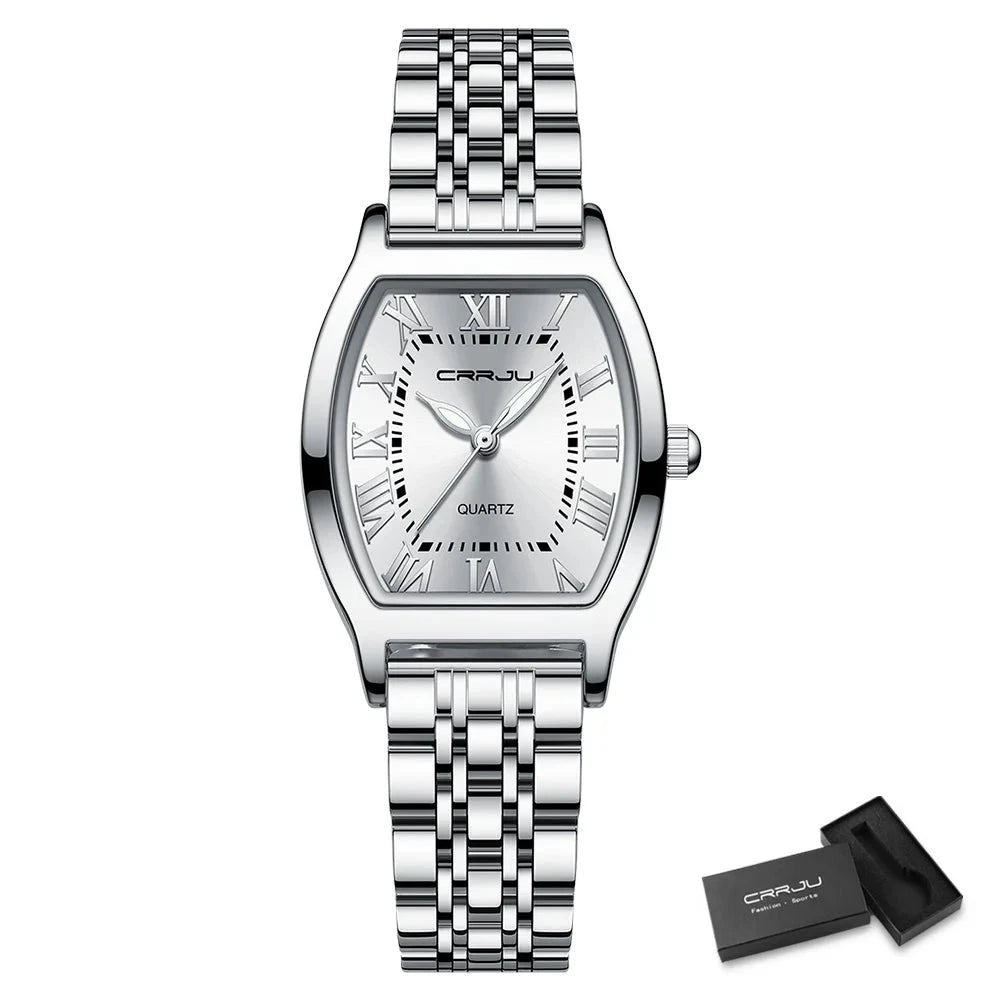 A close-up of a Steel Dress Bracelet Watch featuring a tonneau-shaped alloy case and stainless steel bracelet. The watch dial displays the time against a Hardlex window, with water resistance up to 3Bar.