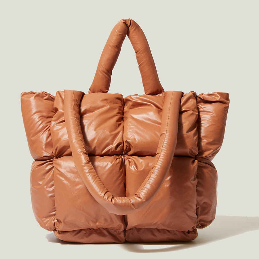 True Radiant Treasures winter quilted bag in vibrant colors. Functional and stylish with a secure zipper closure and inside pocket. Can be carried over the shoulder or across the body.