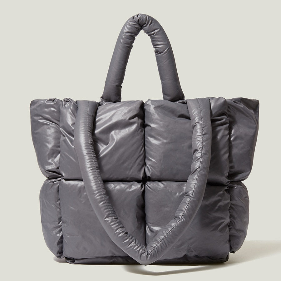 True Radiant Treasures winter quilted bag in vibrant colors. Functional and stylish with a secure zipper closure and inside pocket. Can be carried over the shoulder or across the body.