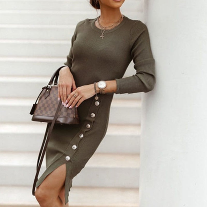 A woman wearing a Mini Skinny Winter Dress in black, featuring a v-neck design and button details, perfect for staying warm and stylish on a winter evening out