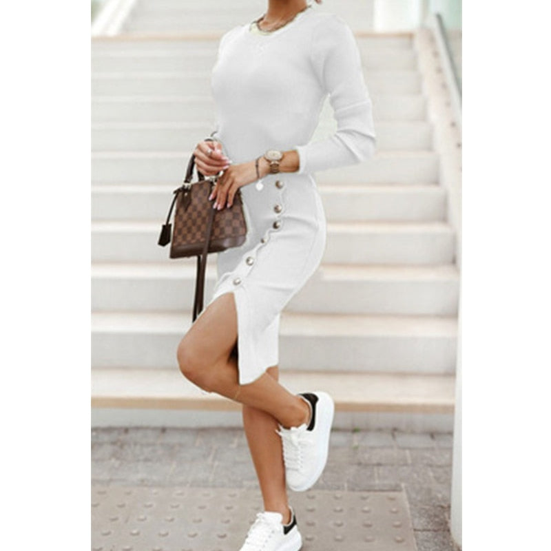 A woman wearing a Mini Skinny Winter Dress in black, featuring a v-neck design and button details, perfect for staying warm and stylish on a winter evening out