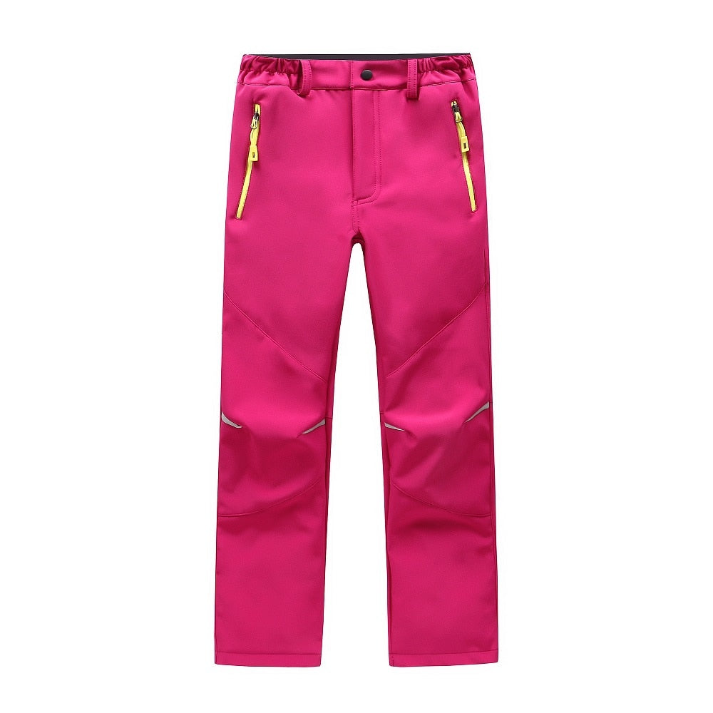 Waterproof Warm Trousers for boys, perfect for fall outdoor activities. Made of polyester and cotton for style, warmth, and comfort. Available in different colors. True-to-size fit based on waist size.