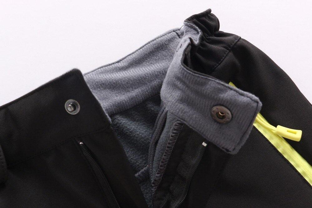 Waterproof Warm Trousers for boys, perfect for fall outdoor activities. Made of polyester and cotton for style, warmth, and comfort. Available in different colors. True-to-size fit based on waist size.