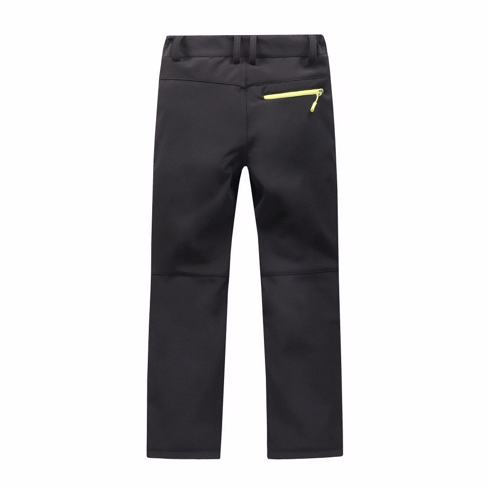 Waterproof Warm Trousers for boys, perfect for fall outdoor activities. Made of polyester and cotton for style, warmth, and comfort. Available in different colors. True-to-size fit based on waist size.