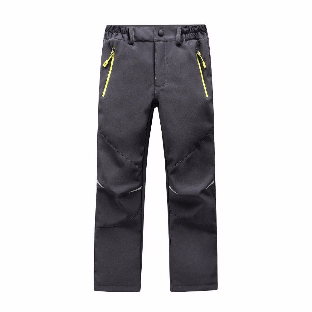 Waterproof Warm Trousers for boys, perfect for fall outdoor activities. Made of polyester and cotton for style, warmth, and comfort. Available in different colors. True-to-size fit based on waist size.