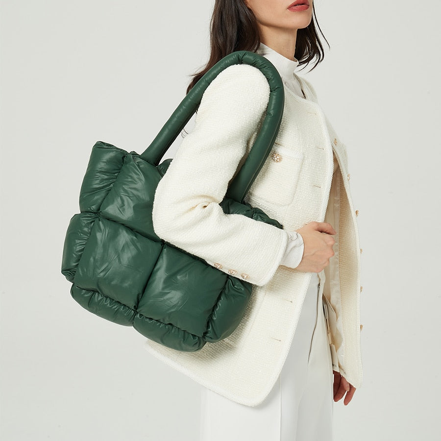 True Radiant Treasures winter quilted bag in vibrant colors. Functional and stylish with a secure zipper closure and inside pocket. Can be carried over the shoulder or across the body.