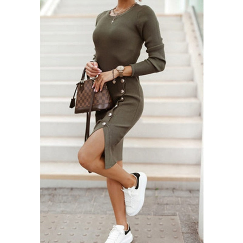 A woman wearing a Mini Skinny Winter Dress in black, featuring a v-neck design and button details, perfect for staying warm and stylish on a winter evening out
