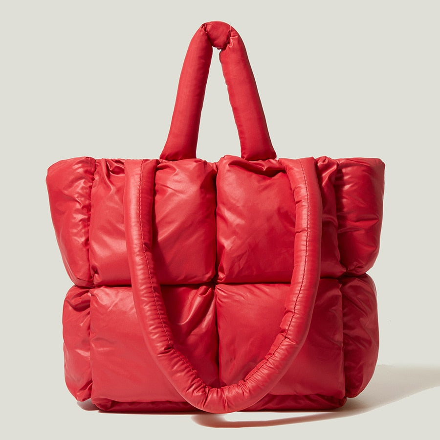 True Radiant Treasures winter quilted bag in vibrant colors. Functional and stylish with a secure zipper closure and inside pocket. Can be carried over the shoulder or across the body.