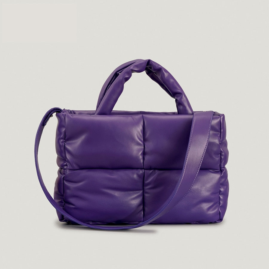 True Radiant Treasures winter quilted bag in vibrant colors. Functional and stylish with a secure zipper closure and inside pocket. Can be carried over the shoulder or across the body.