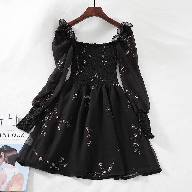 Chic black vintage spring dress with unique puff sleeves, ruffles, and A-line silhouette, made from comfortable and durable synthetic fiber, acrylic, and chiffon fabric.