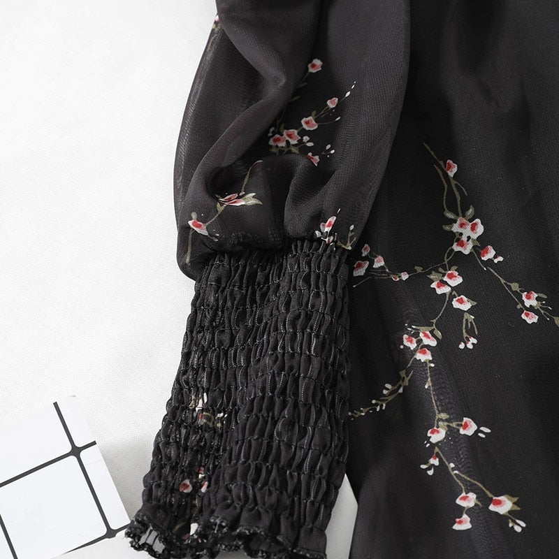 Chic black vintage spring dress with unique puff sleeves, ruffles, and A-line silhouette, made from comfortable and durable synthetic fiber, acrylic, and chiffon fabric.