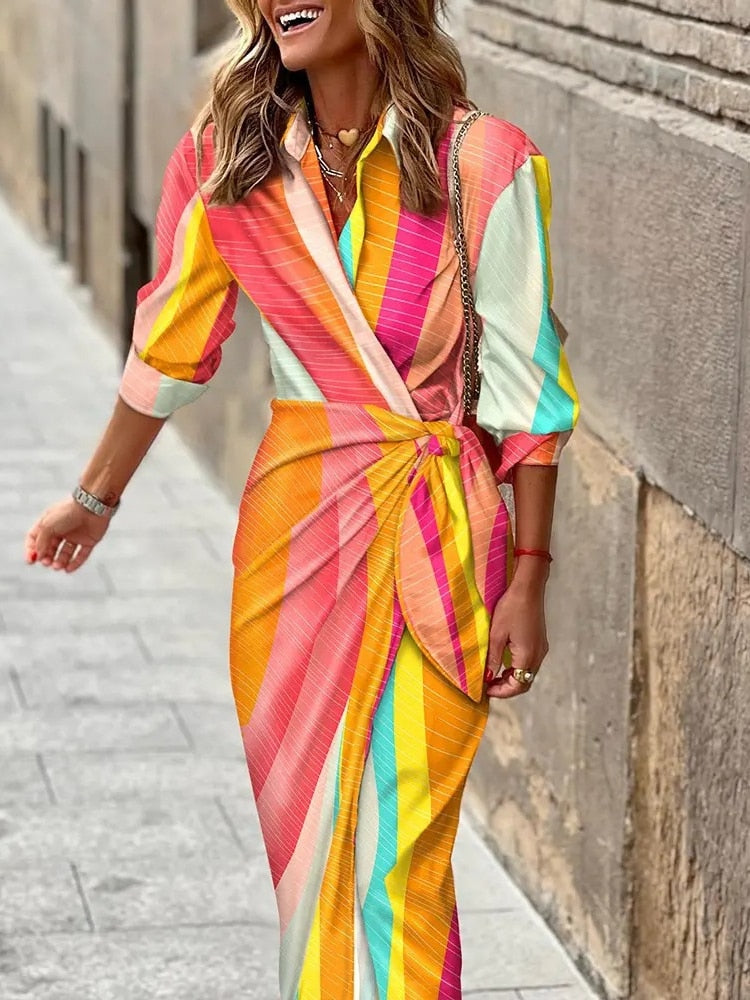 Stunning spring v-neck dress with ankle-length design, vibrant colors, and comfortable polyester-acetate fabric for a versatile and fashionable look.