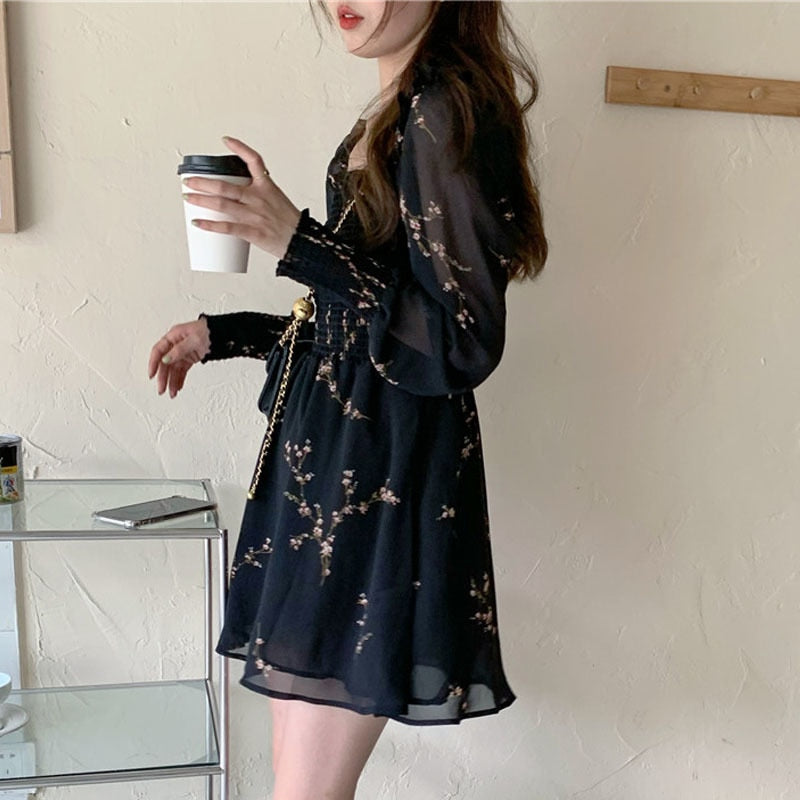 Chic black vintage spring dress with unique puff sleeves, ruffles, and A-line silhouette, made from comfortable and durable synthetic fiber, acrylic, and chiffon fabric.