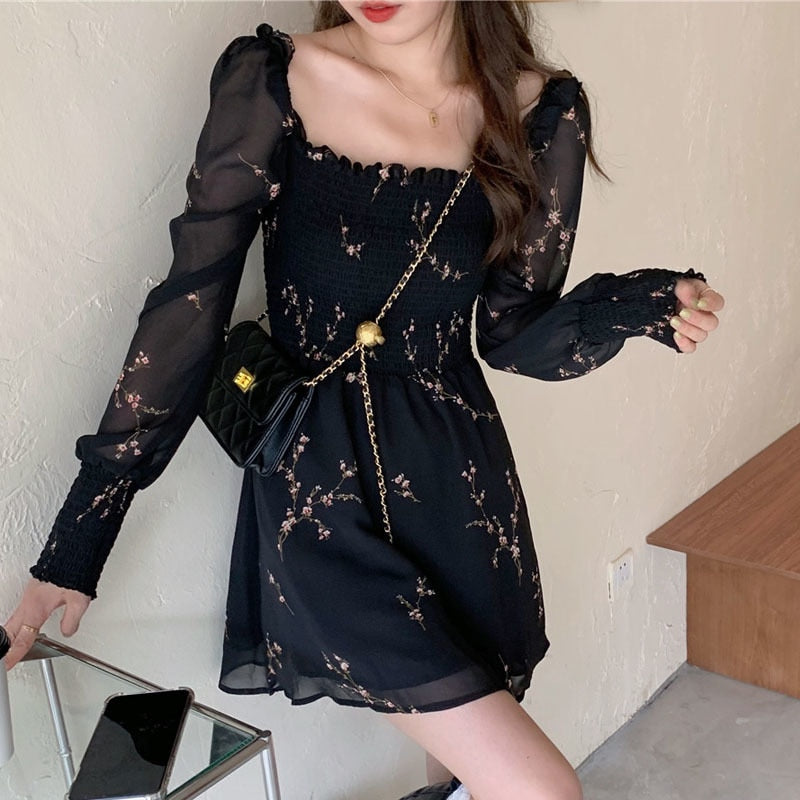Chic black vintage spring dress with unique puff sleeves, ruffles, and A-line silhouette, made from comfortable and durable synthetic fiber, acrylic, and chiffon fabric.