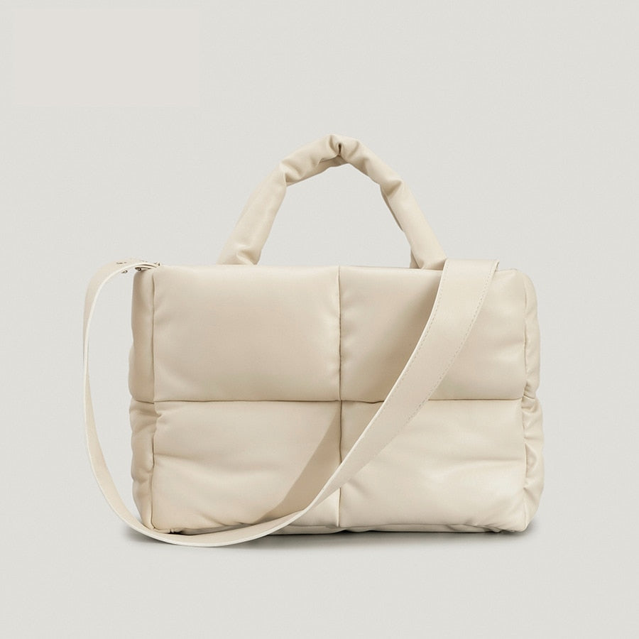 True Radiant Treasures winter quilted bag in vibrant colors. Functional and stylish with a secure zipper closure and inside pocket. Can be carried over the shoulder or across the body.