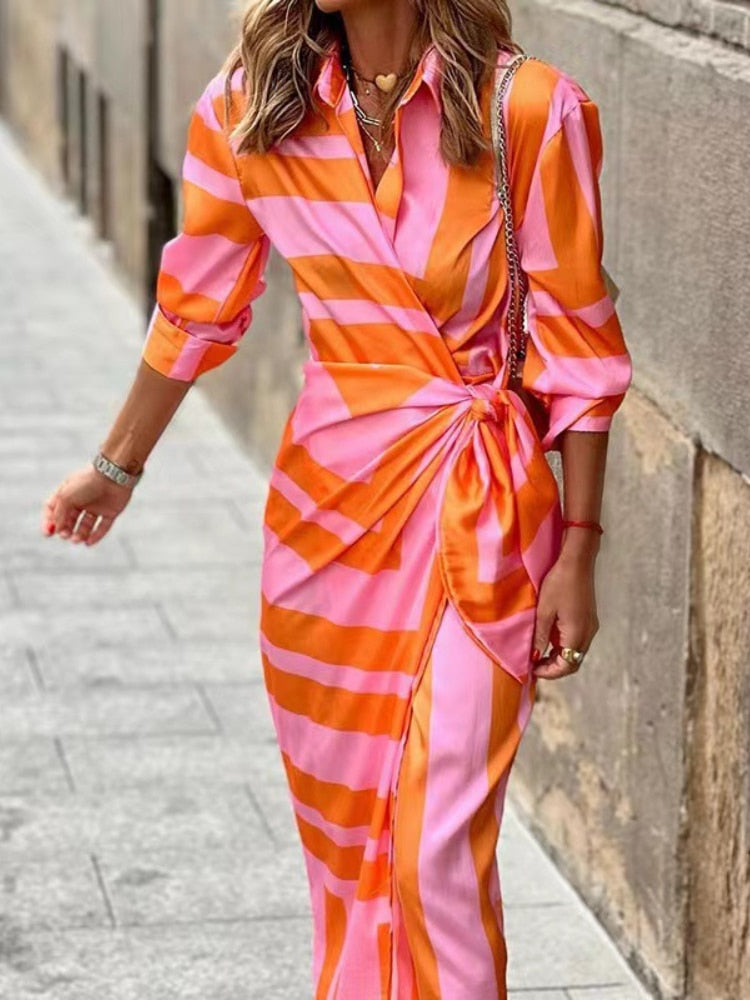 Stunning spring v-neck dress with ankle-length design, vibrant colors, and comfortable polyester-acetate fabric for a versatile and fashionable look.