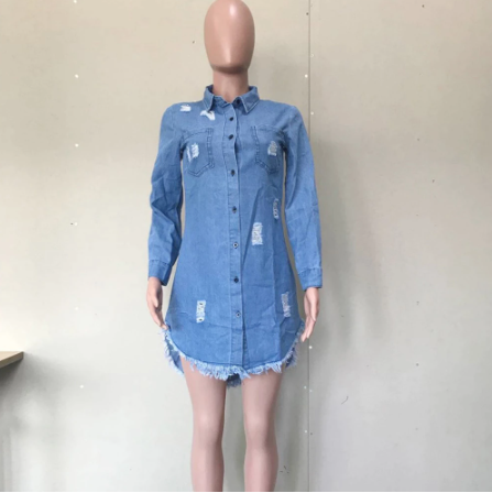 Chic woman wearing Long Denim Jacket with turn-down collar and empire waistline, styled as a mini dress with high heels