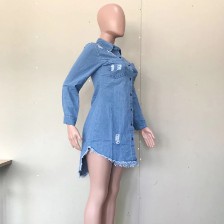Chic woman wearing Long Denim Jacket with turn-down collar and empire waistline, styled as a mini dress with high heels