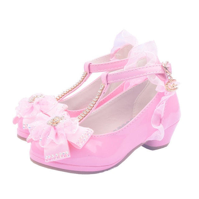 Stylish Peep shoes with cut-out flower designs, perfect for girls' dress-up or casual wear.