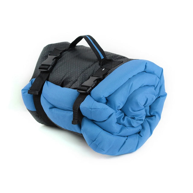 Image of Portable Waterproof Dog Bed - Travel-friendly and durable, ideal for camping, hiking, and road trips. Waterproof microtomic ripstop top with non-slip Rufftex bottom. Easily rolls up for storage with a handle for transport. Available in Medium (27" x 36" x 2") and Large (36" x 48" x 3") sizes. Weighs 2.2 pounds (Medium) and 3.7 pounds (Large). Hand wash or machine wash gentle cycle. Hang dry.