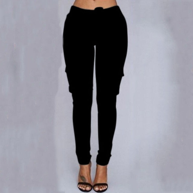 A woman wearing High Waist Jogger Pants in black color with pockets, elastic waistband and drawstring closure