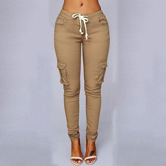 A woman wearing High Waist Jogger Pants in black color with pockets, elastic waistband and drawstring closure